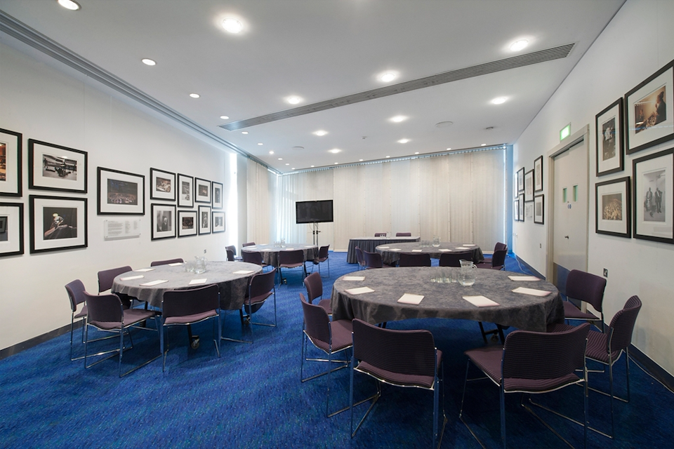 Hire The Bridgewater Hall  | Spaces Unlocked | blue carpet with round tables